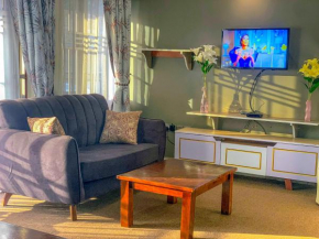 3BR Family-Friendly Apt with Power Backup, Private Gardens, WiFi,Close to Amenities